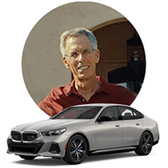 Image of John and his BMW Model.