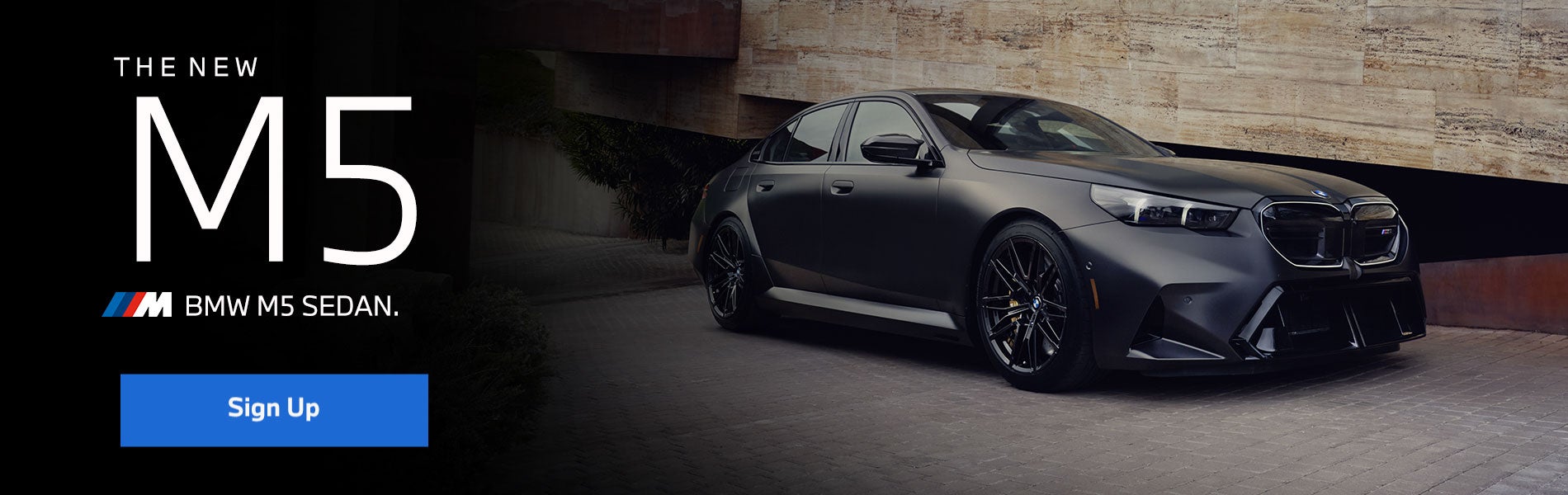 New BMW M5 Sedan parked.