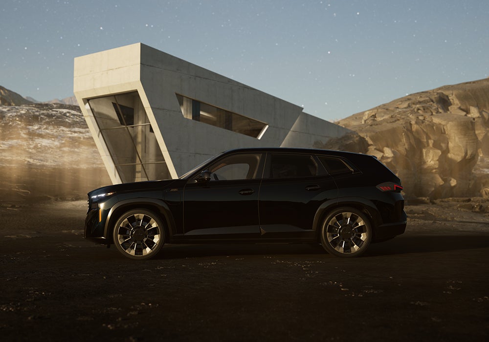 BMW XM Parked in front of cement building. BMW Showcase 1 in Derwood MD