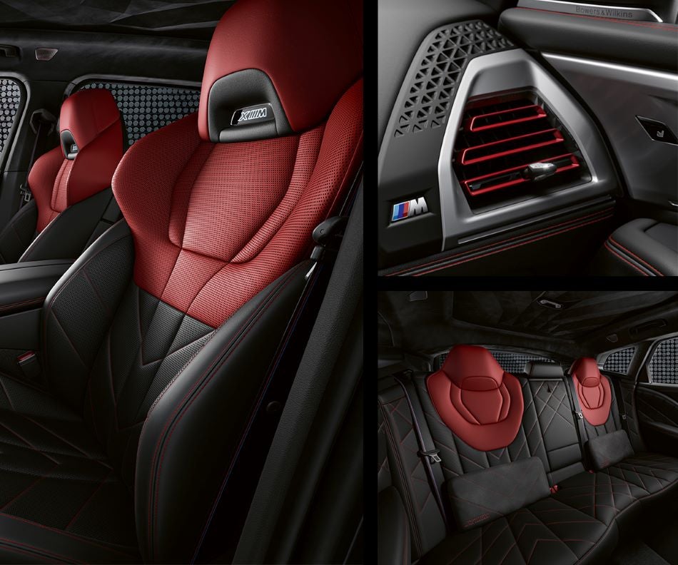 Detail of front seats, clad in exclusive BMW Individual Fiona Red & Black Merino Leather with exclusive M Signature Trim and red stitching and accents. Detail of red accented vent. Detail of rear M Lounge with exclusive XM pillows in BMW Showcase 1 | Derwood MD